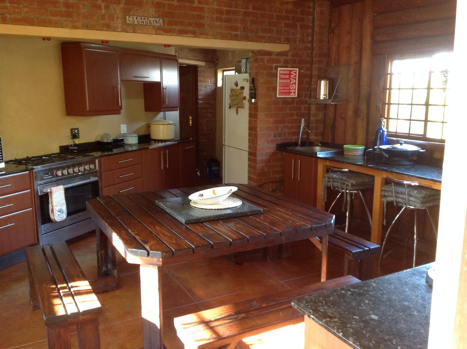 Communal kitchen with wooden dining table