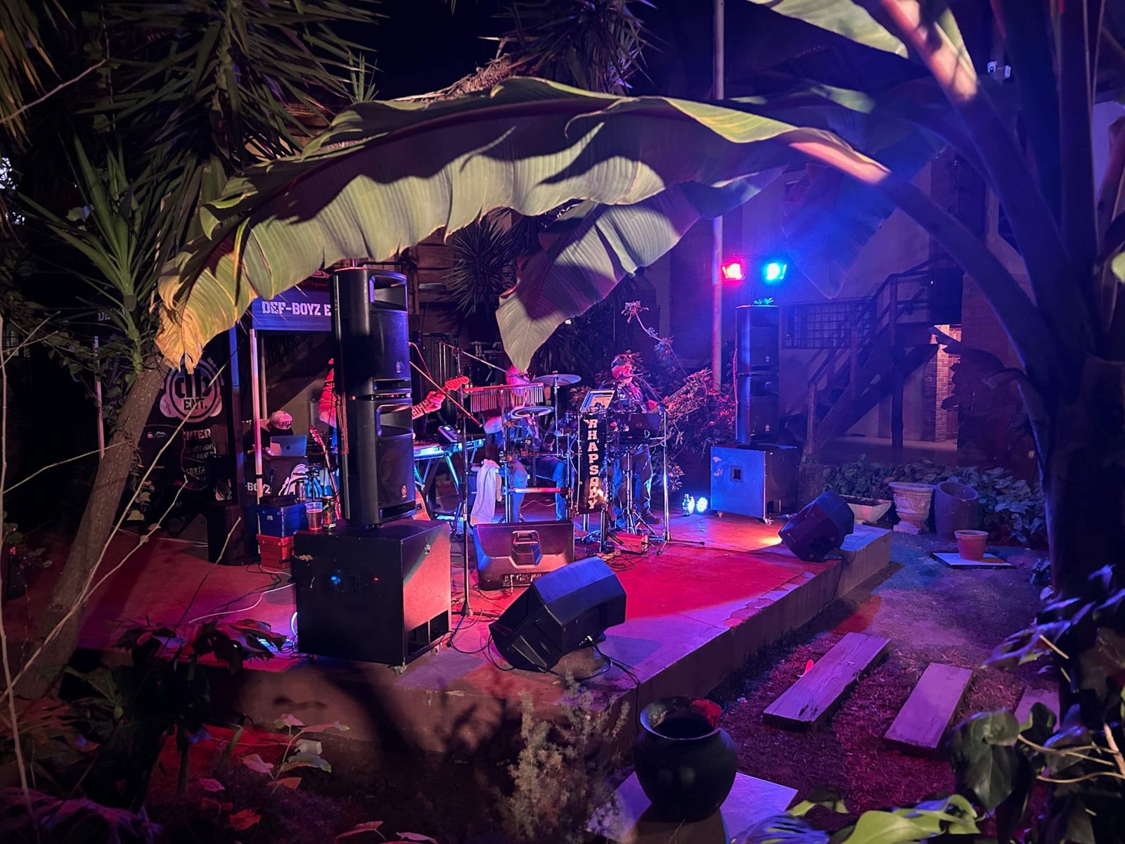 Band stage with lights at night at Sparrow Hawk Lodge