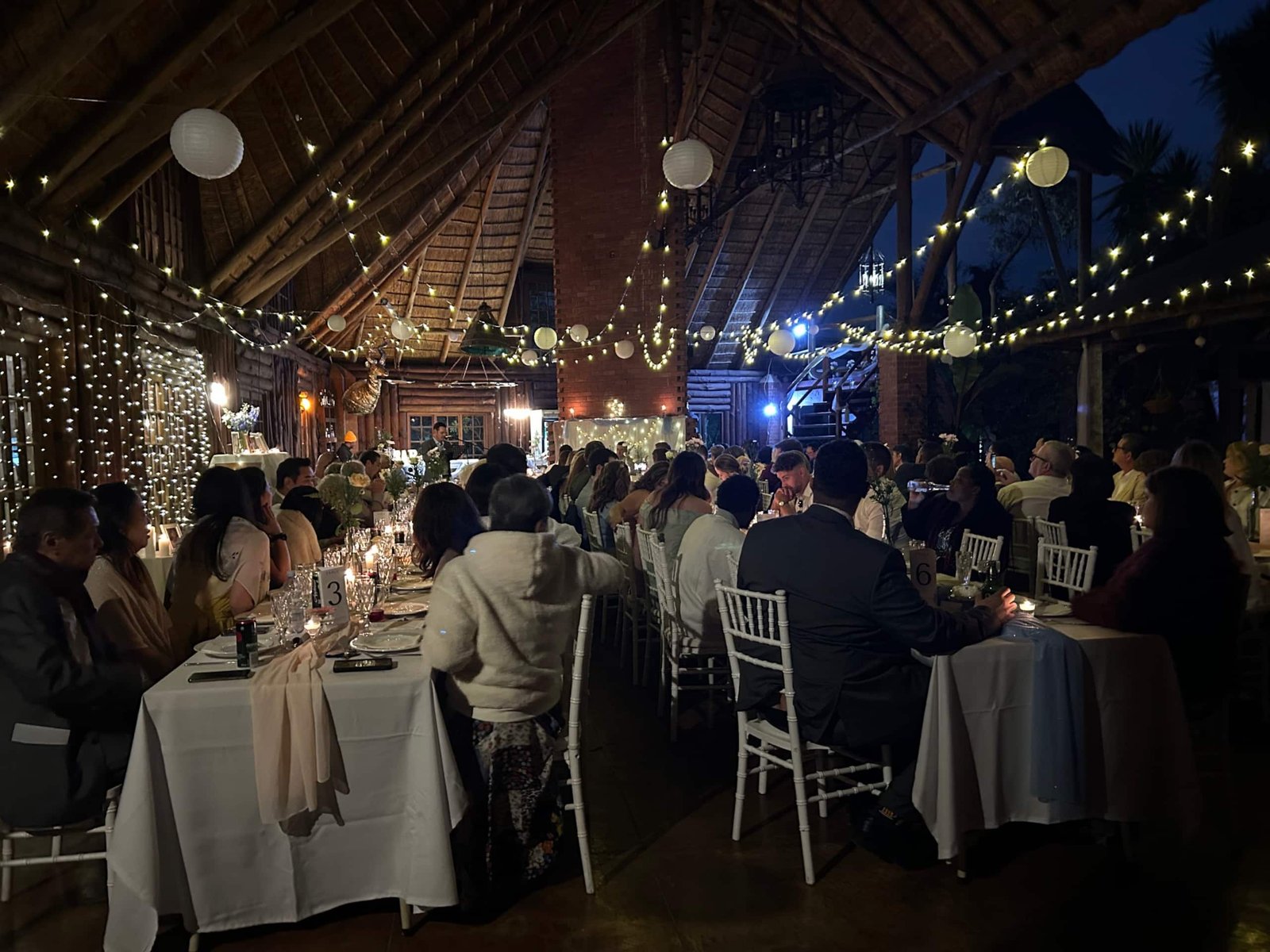 Wedding reception under fairy lights at Sparrow Hawk Lodge