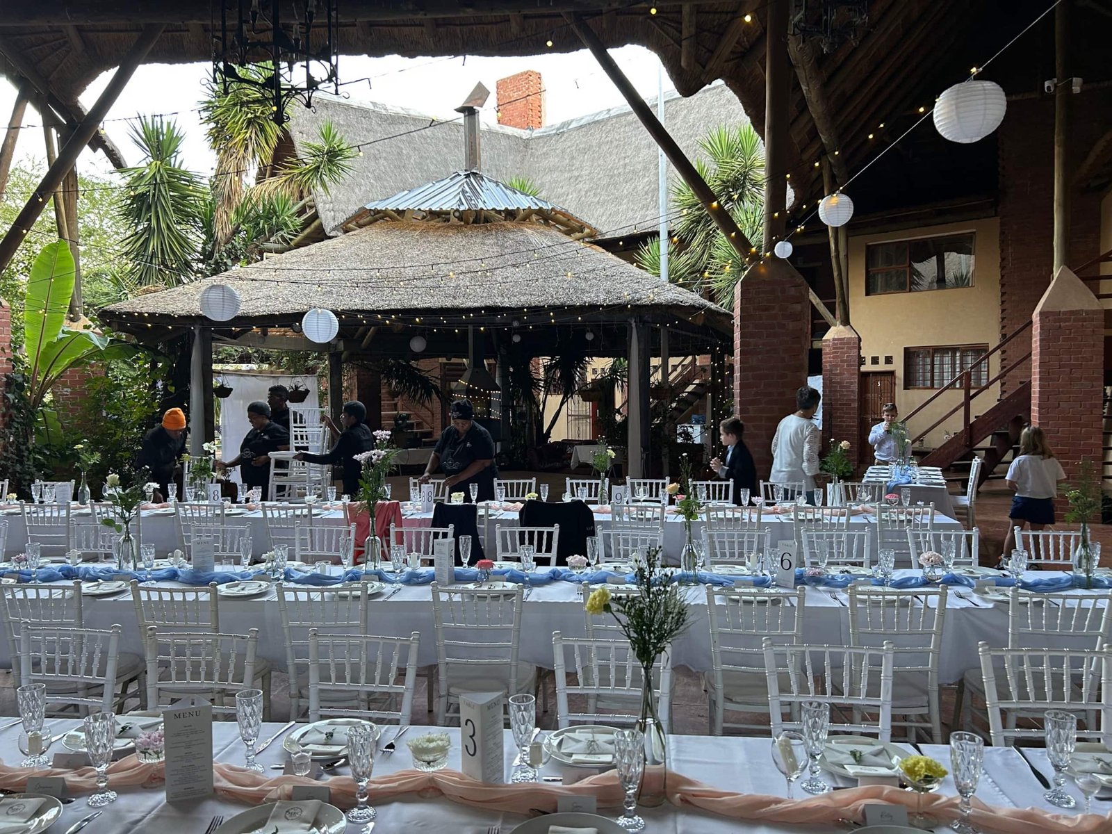 Courtyard banquet beside the thatched gazebo